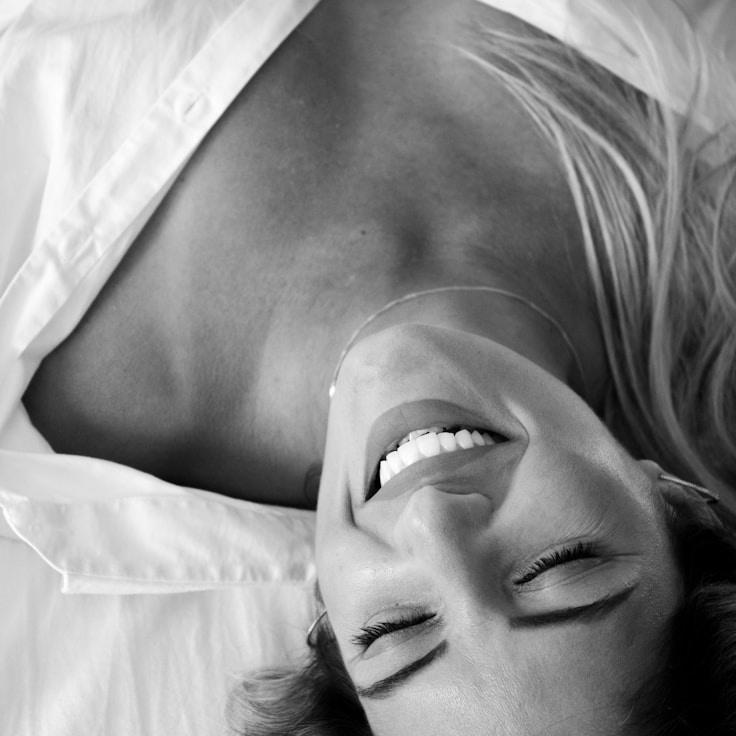 Kaveri Mehta, Lead Design Curator at Stone Bridge Haven, reviewing corporate floral arrangements